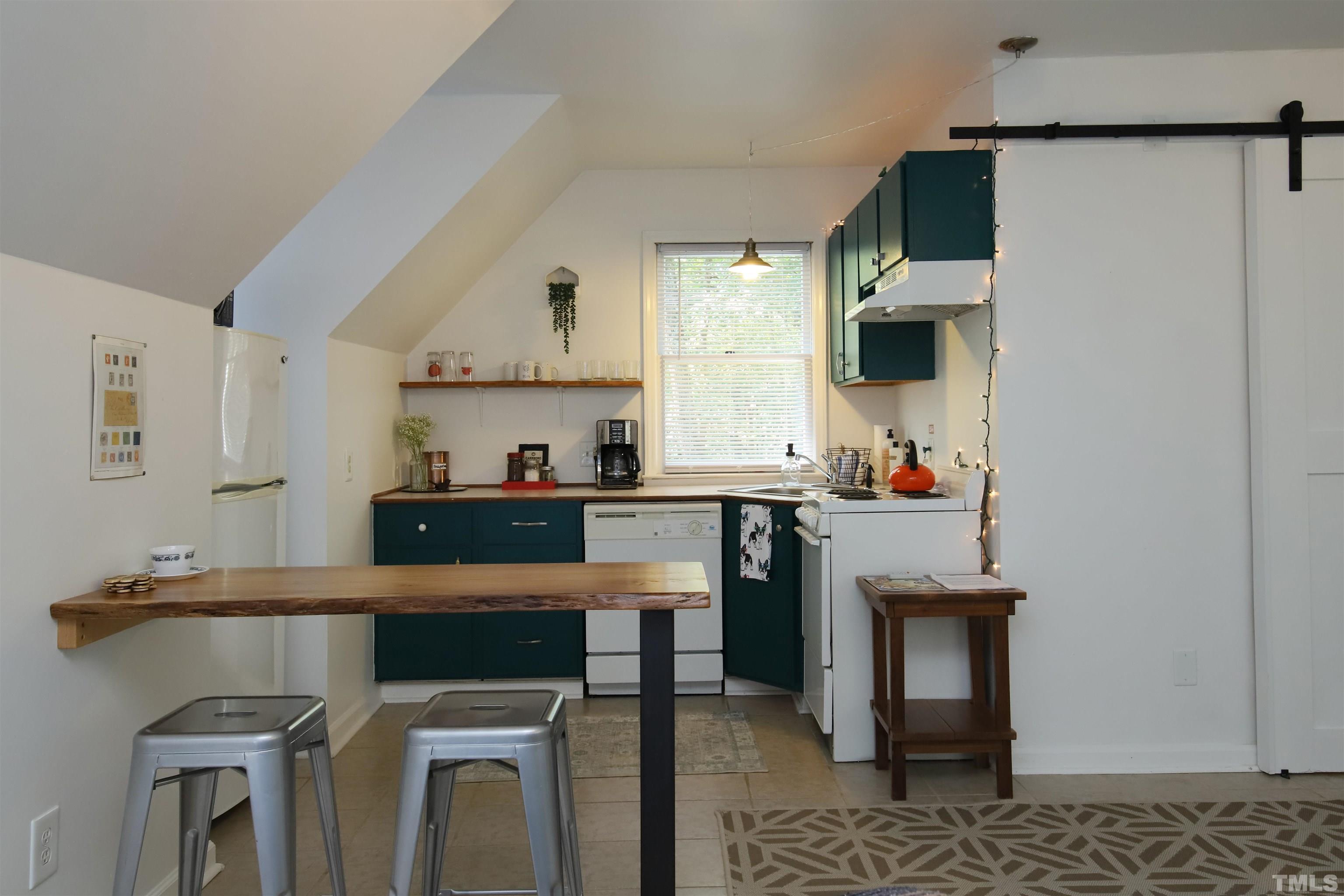 13 Williams Durham, NC 27704 - Photo 6 of 23 a kitchen with stainless steel appliances a sink stove and cabinets