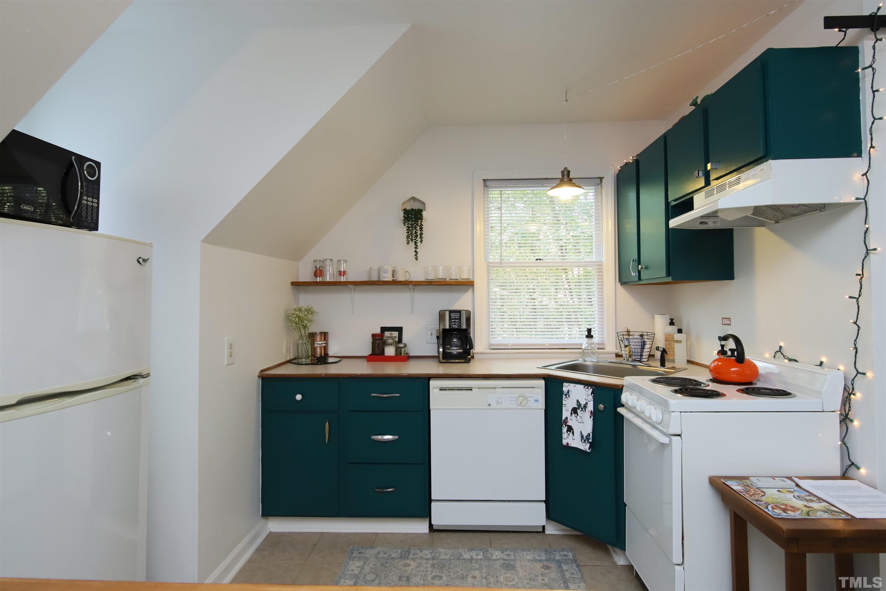 13 Williams Durham, NC 27704 - Photo 7 of 23 a kitchen with a sink a stove and cabinets