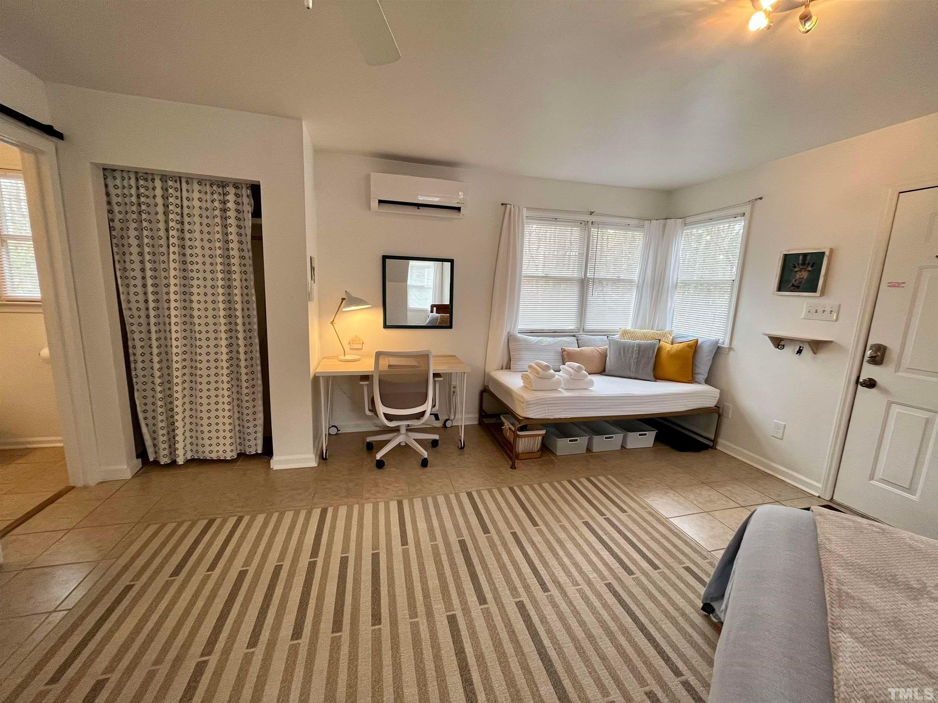 13 Williams Durham, NC 27704 - Photo 10 of 23 a living room with furniture and a window