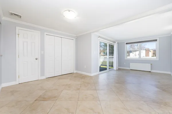 a view of an empty room with a window