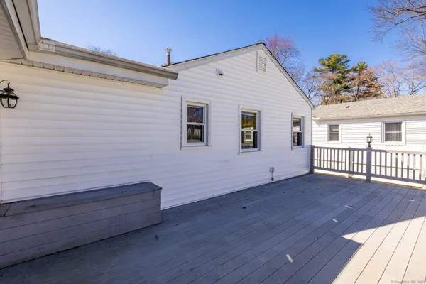 a view of a house with wooden deck