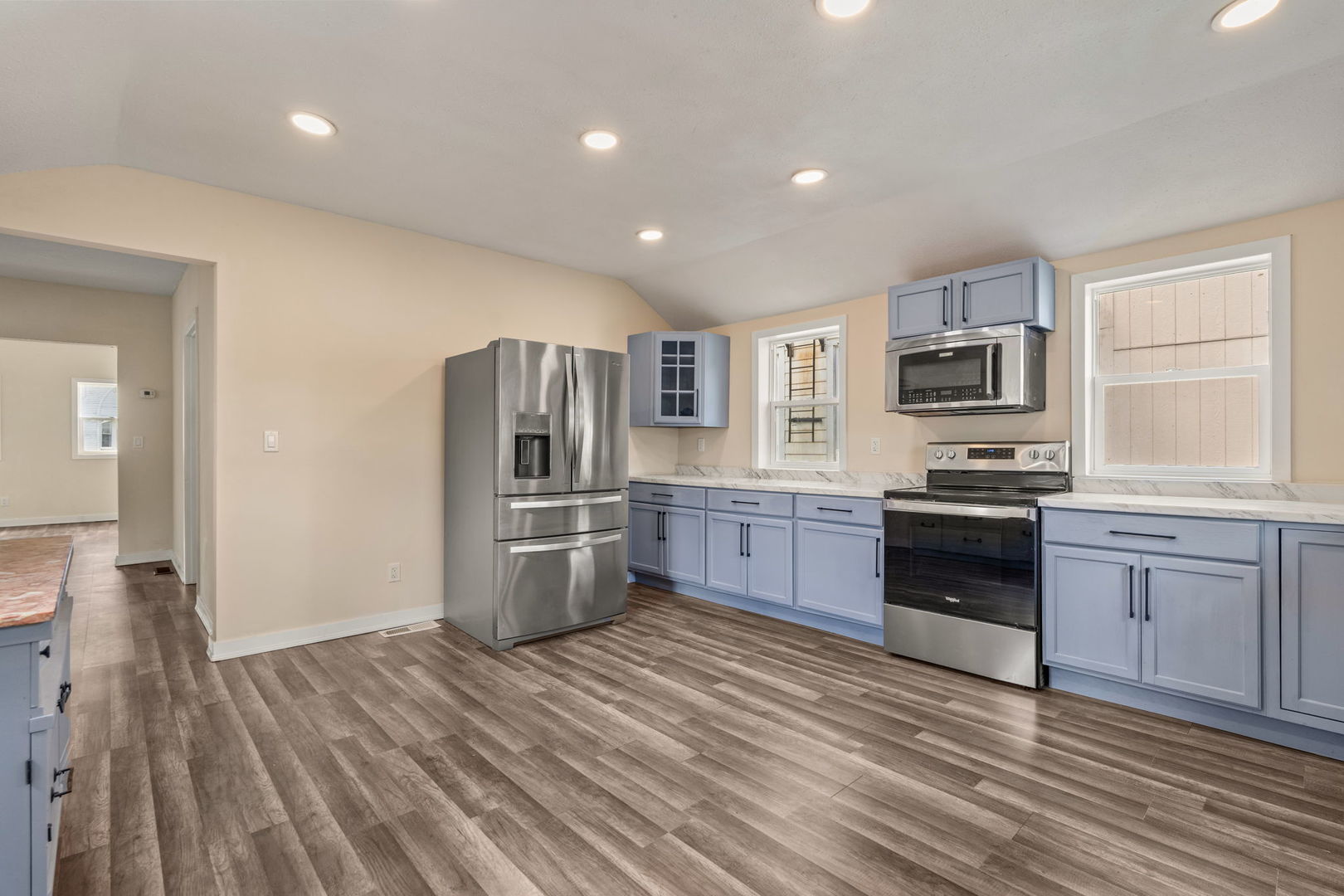 548 7th Avenue South Clinton, IA 52732 - Photo 11 of 23 a kitchen with granite countertop stainless steel appliances and wooden cabinets