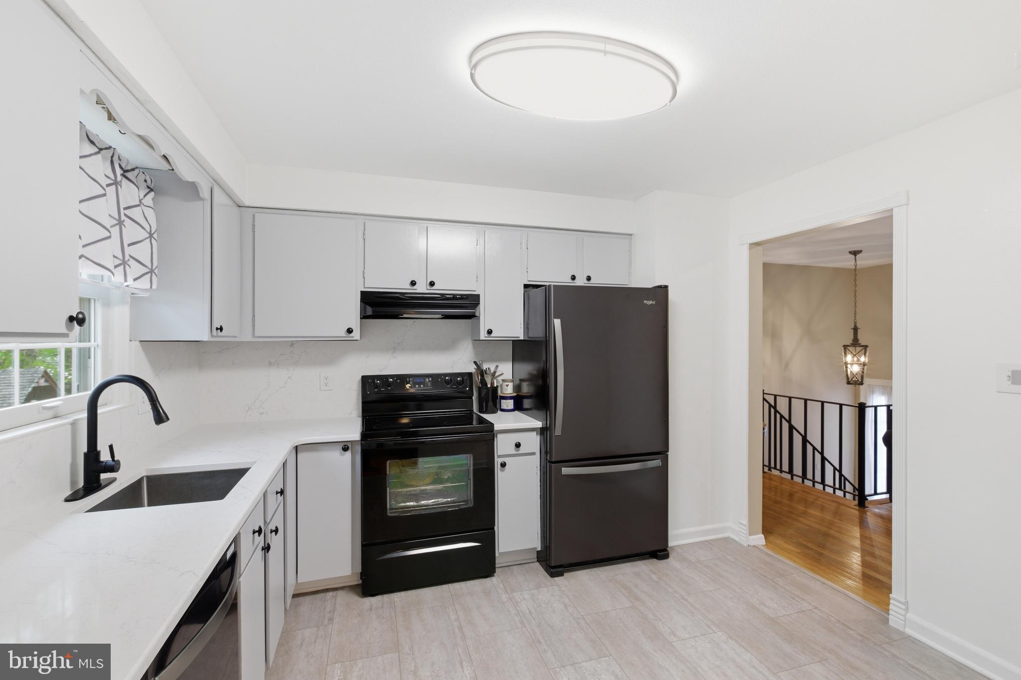 194 Bull Run Road Ewing, NJ 08638 - Photo 11 of 29 a kitchen with granite countertop a refrigerator and a sink