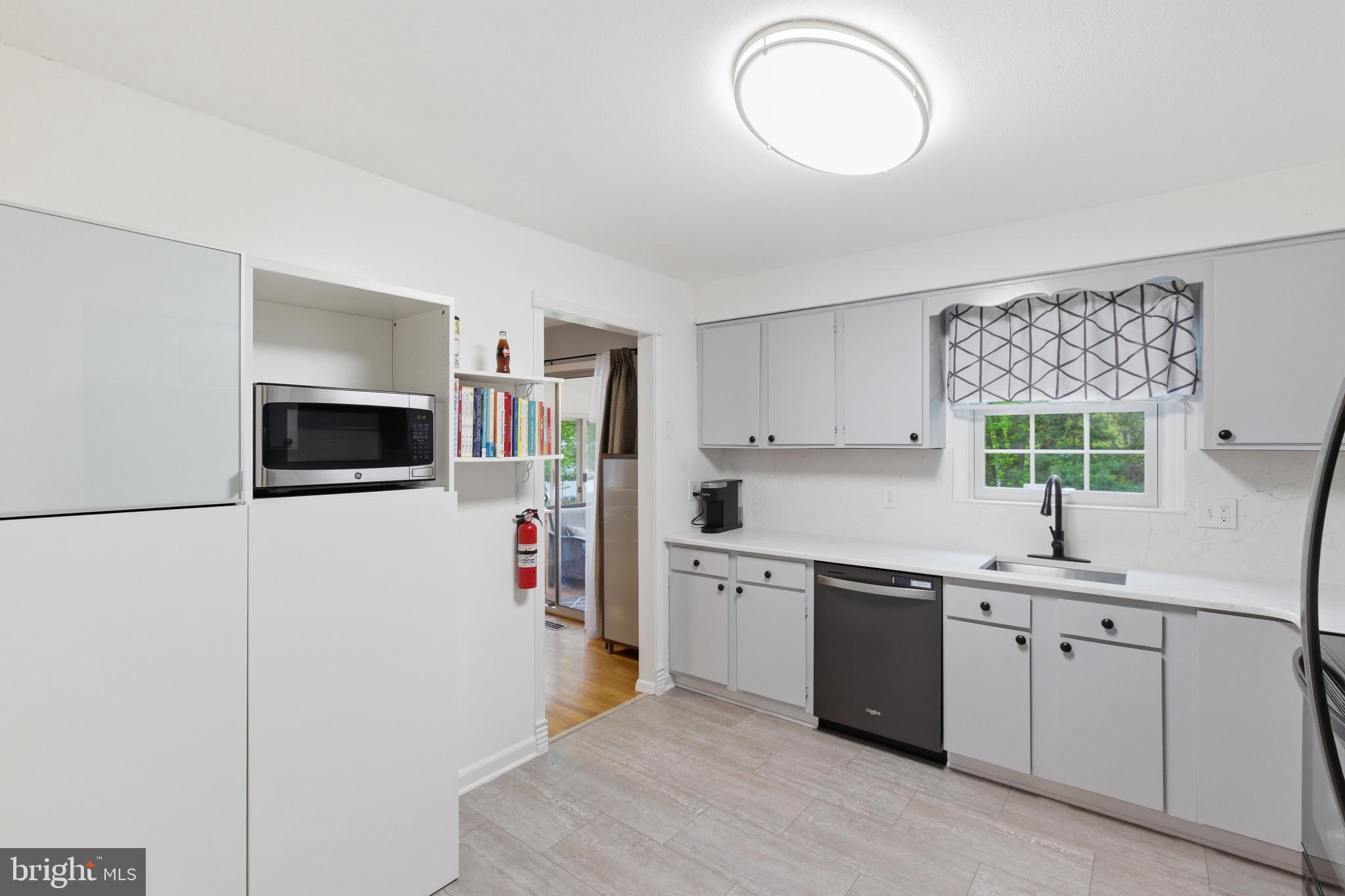194 Bull Run Road Ewing, NJ 08638 - Photo 12 of 29 a kitchen with a sink and a refrigerator
