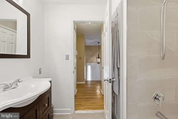 a bathroom with a sink and mirror