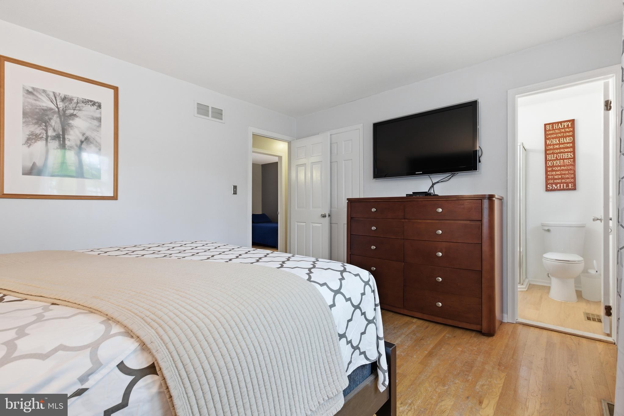 194 Bull Run Road Ewing, NJ 08638 - Photo 19 of 29 a bedroom with a bed and a flat screen tv