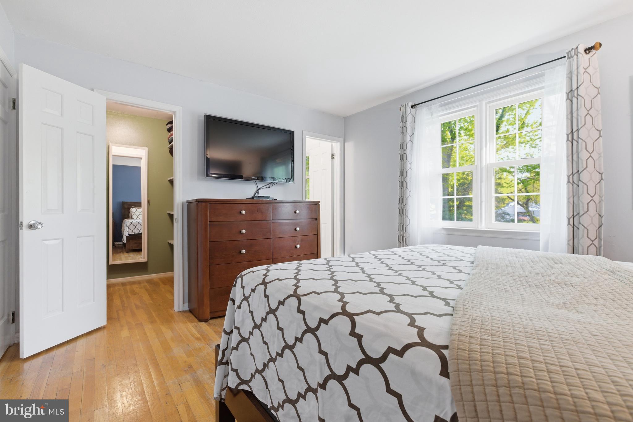 194 Bull Run Road Ewing, NJ 08638 - Photo 20 of 29 a bedroom with a bed and a flat screen tv