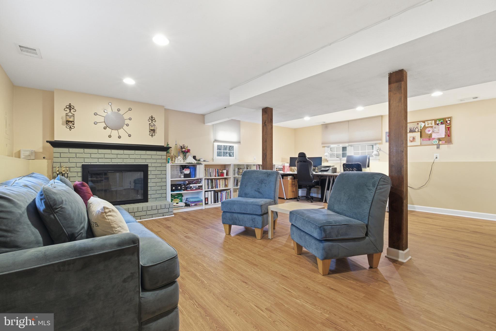 194 Bull Run Road Ewing, NJ 08638 - Photo 23 of 29 a living room with furniture a fireplace a rug and a large window