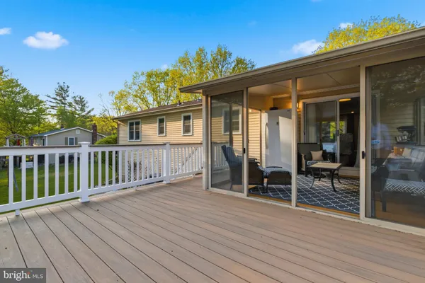 a view of a house with a wooden deck