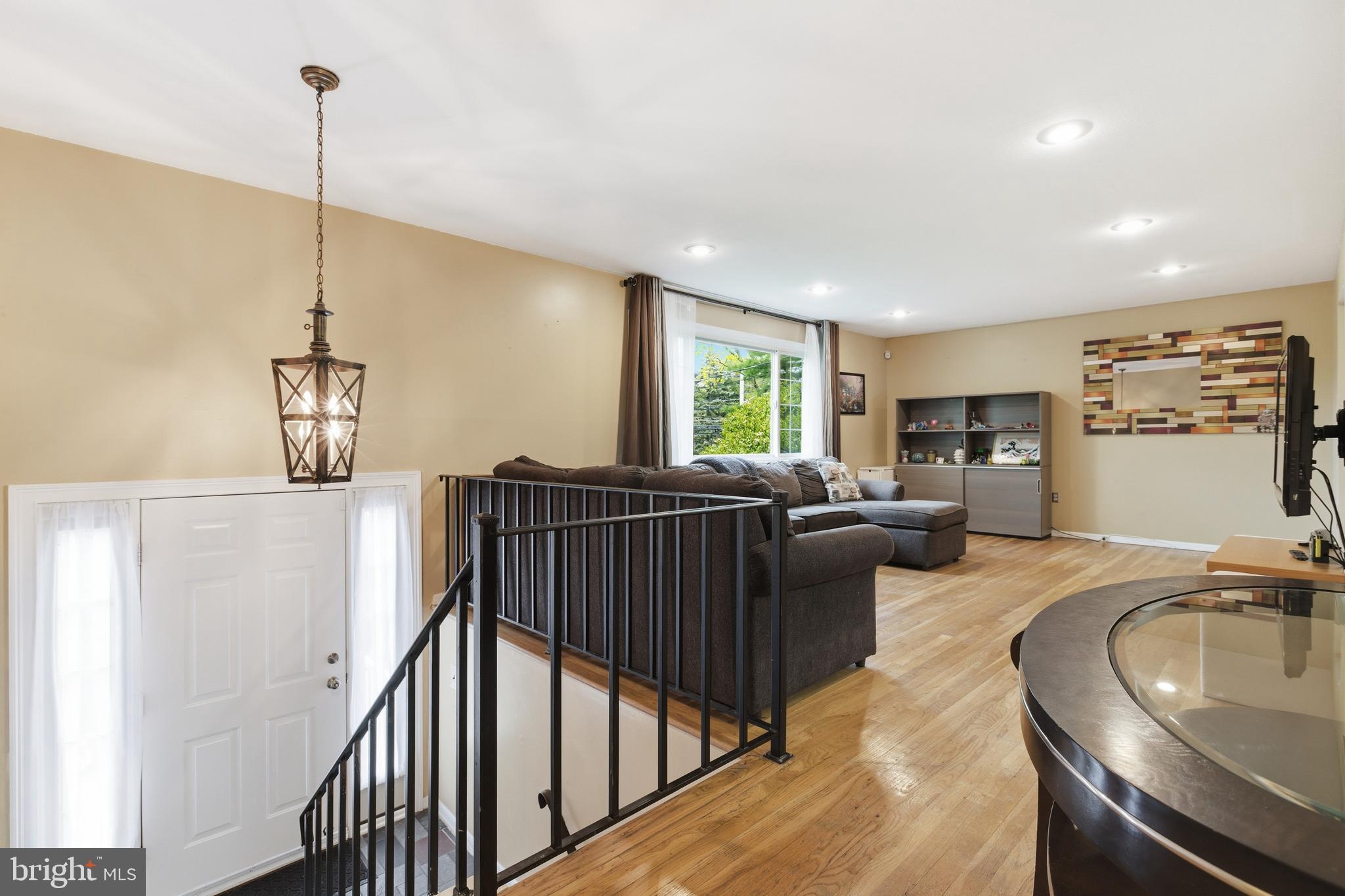 194 Bull Run Road Ewing, NJ 08638 - Photo 7 of 29 a living room with furniture windows and a chandelier