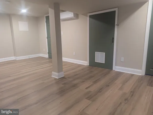 a view of wooden floor and brick walls