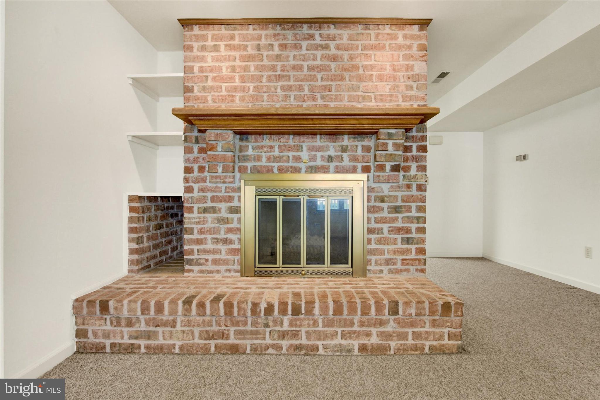 20020 Mt Aetna Road Hagerstown, MD 21742 - Photo 37 of 54 Brick wood-burning fireplace.