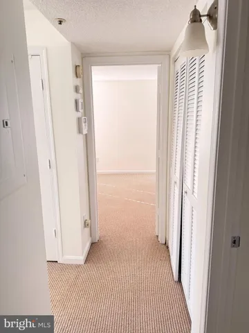 a view of a bedroom from a hallway