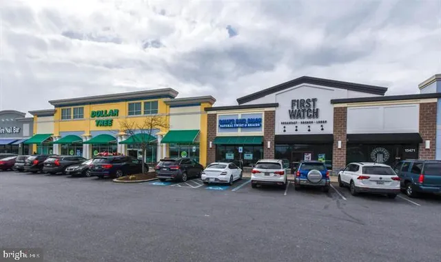 a kitchen with stainless steel appliances granite countertop a stove and a refrigerator
