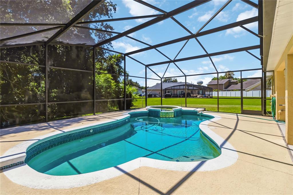 3225 Canoe Creek Road St. Cloud, FL 34772 - Photo 27 of 30 a view of a backyard with swimming pool