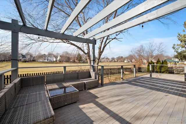 a view of a lake with a yard and mountain view