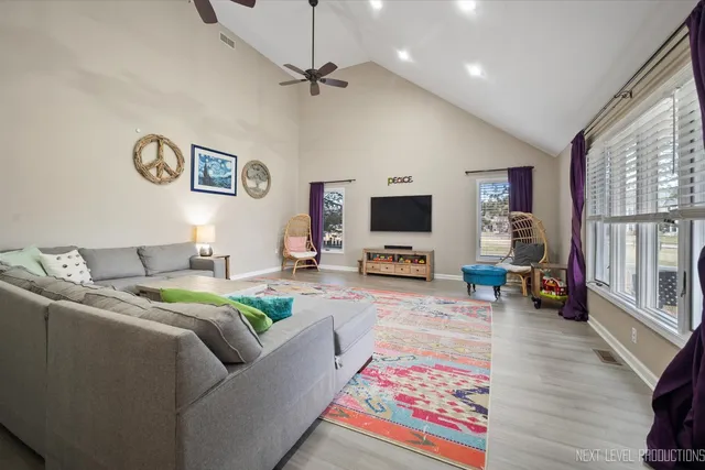 a living room with furniture and a rug