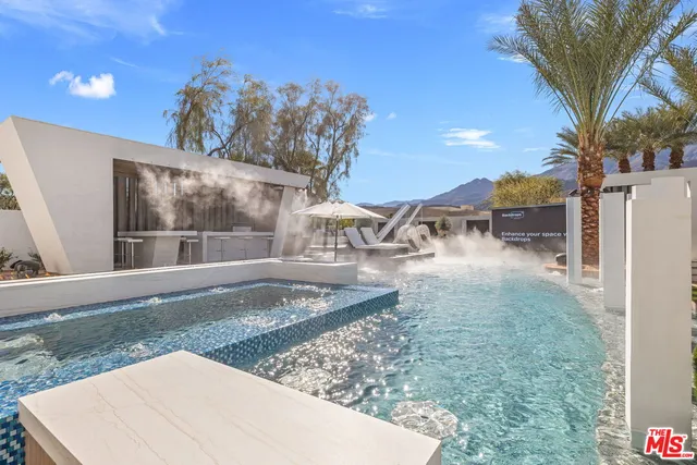 a kitchen with stainless steel appliances granite countertop a lot of counter space and wooden floors