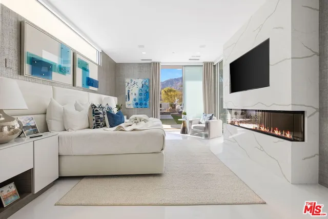 a bathroom with a bathtub and potted plant