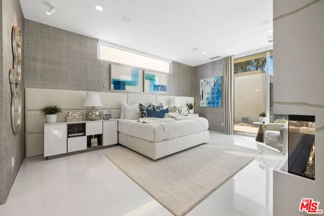 a spacious bathroom with a tub shower and sink