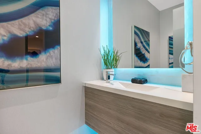 a view of a swimming pool with a patio and plants