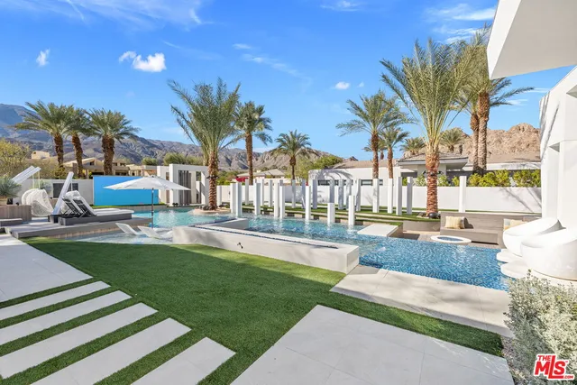 a front view of a house with garden and porch