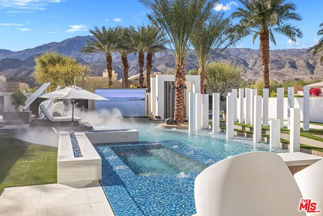 a kitchen that has a lot of cabinets in it and appliances