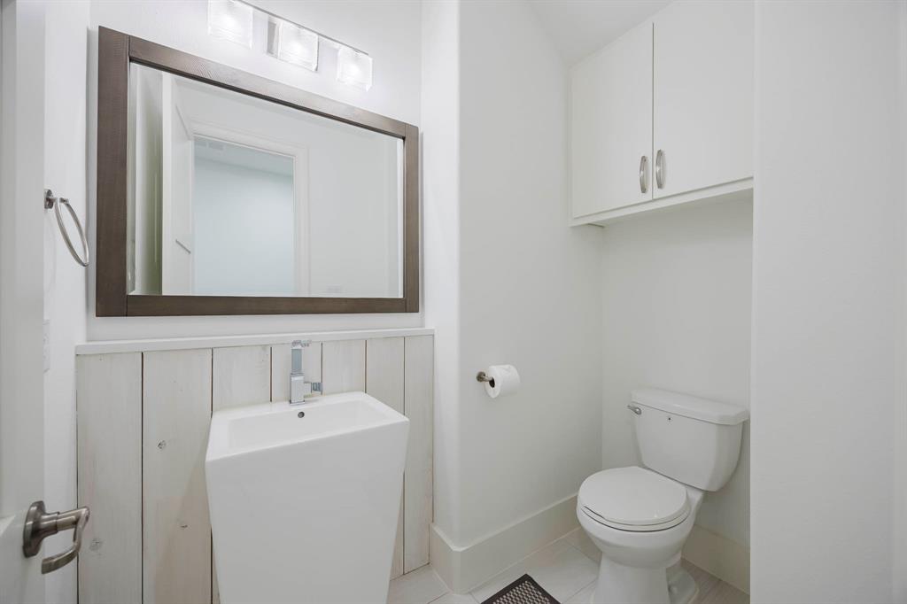 2081 Holt Way Grapevine, TX 76051 - Photo 23 of 40 a bathroom with a toilet sink and mirror