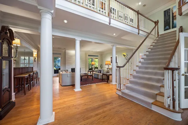 a view of an entryway with dining room and wooden floor