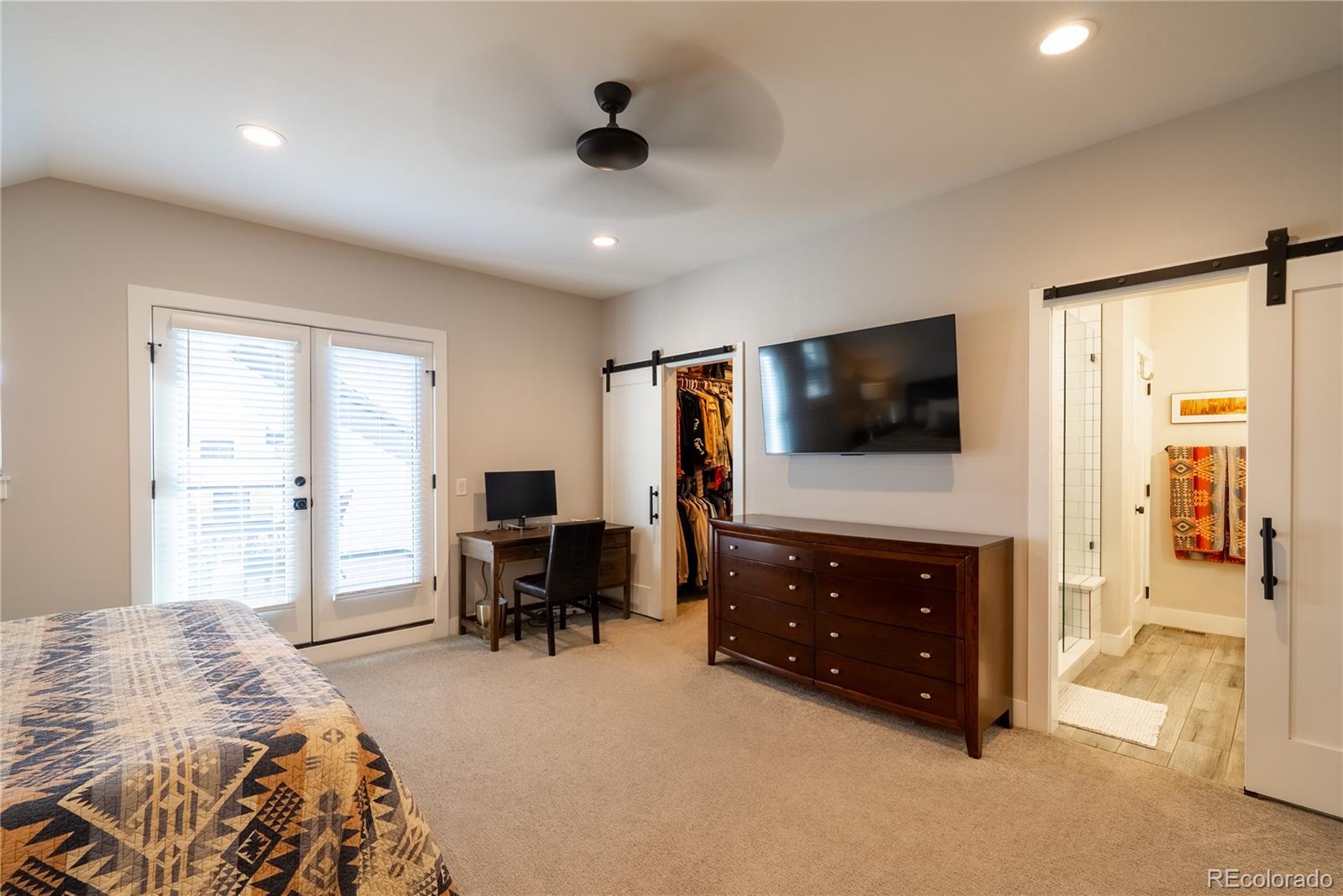 4035 Osage Street Denver, CO 80211 - Photo 12 of 29 a living room with furniture and a flat screen tv