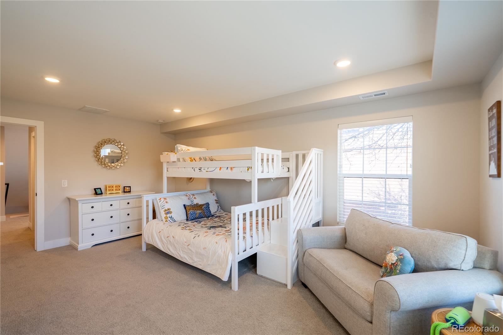 4035 Osage Street Denver, CO 80211 - Photo 18 of 29 a bedroom with furniture and a large window