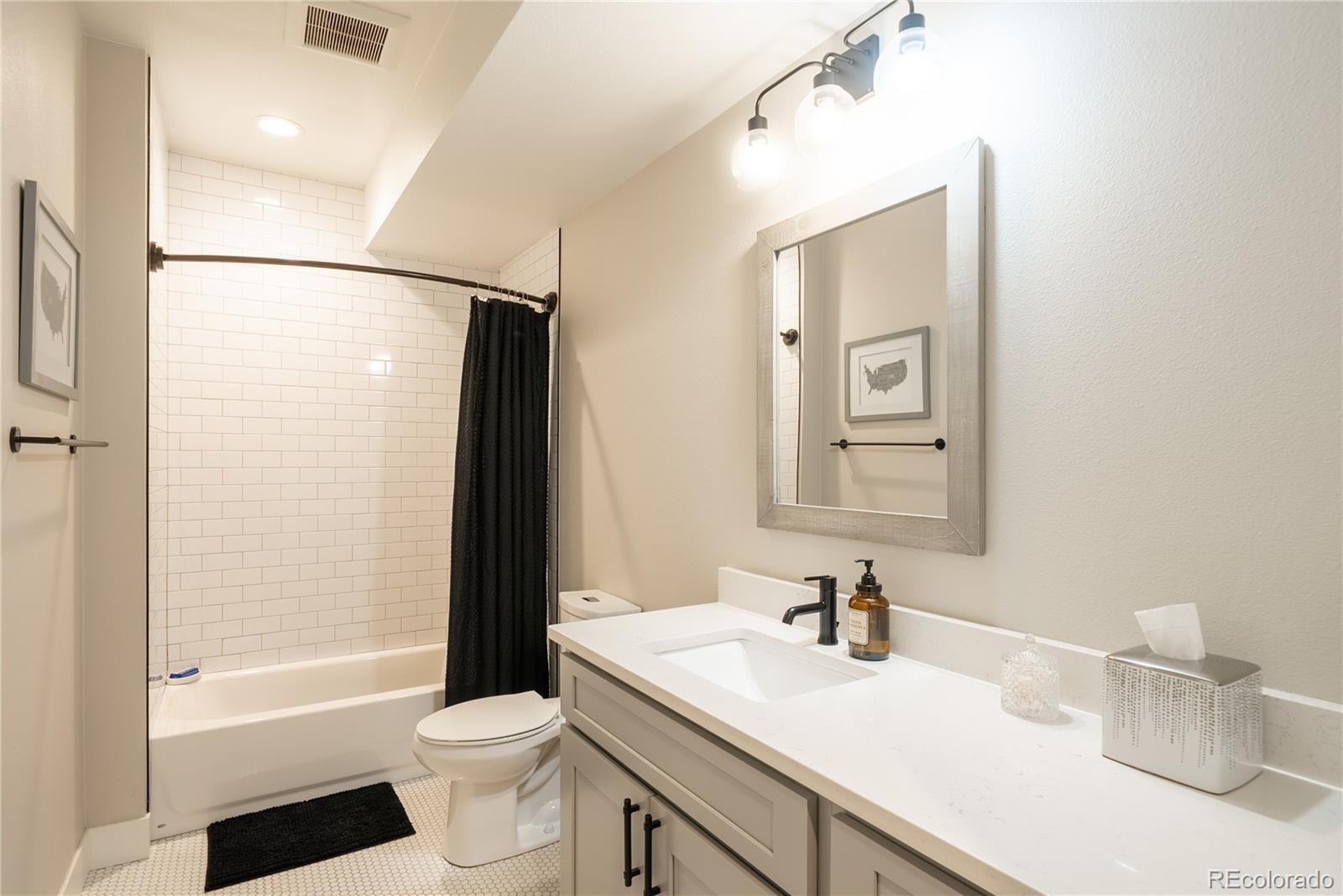 4035 Osage Street Denver, CO 80211 - Photo 24 of 29 a bathroom with a sink a toilet and shower