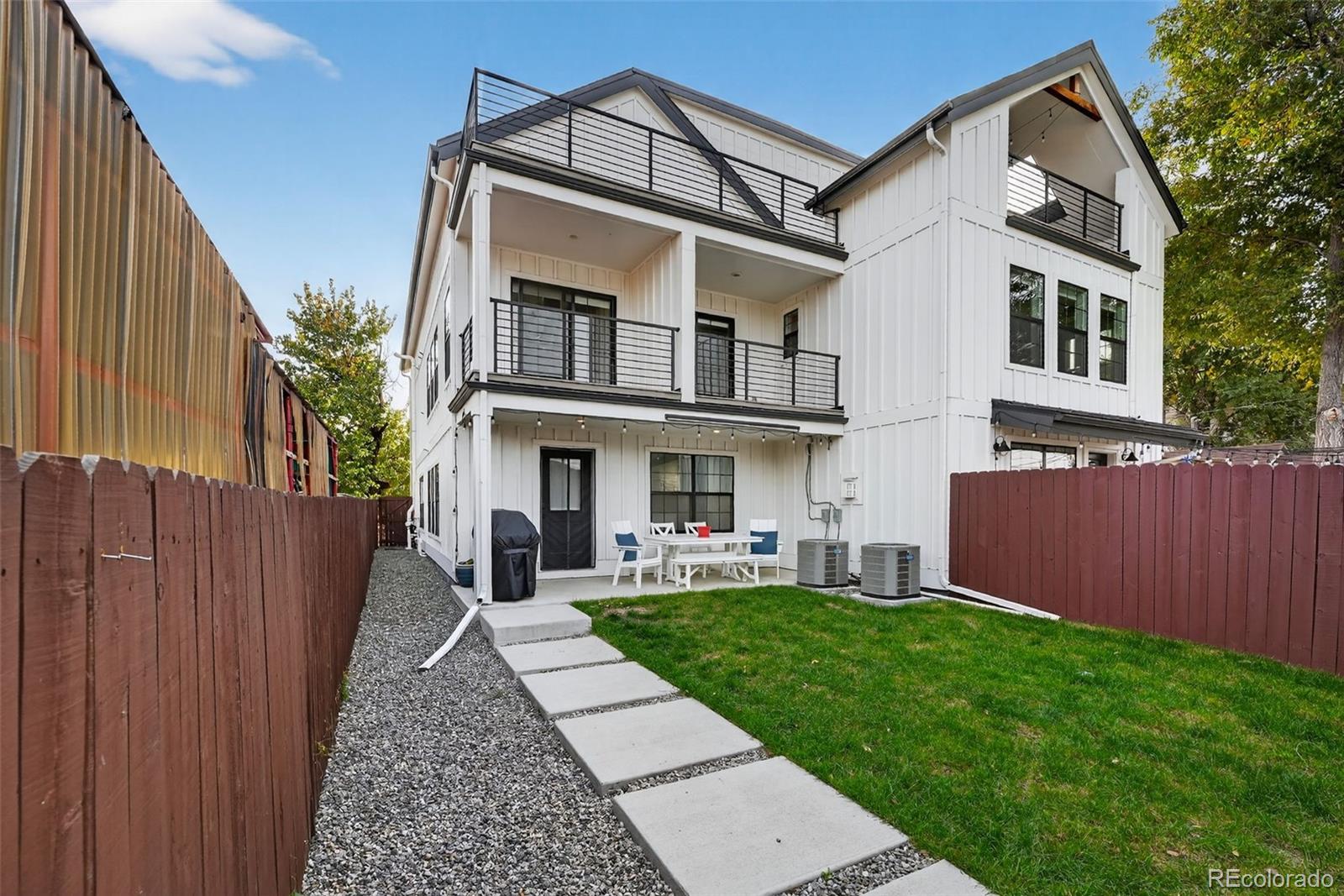 4035 Osage Street Denver, CO 80211 - Photo 25 of 29 a view of a building with a yard