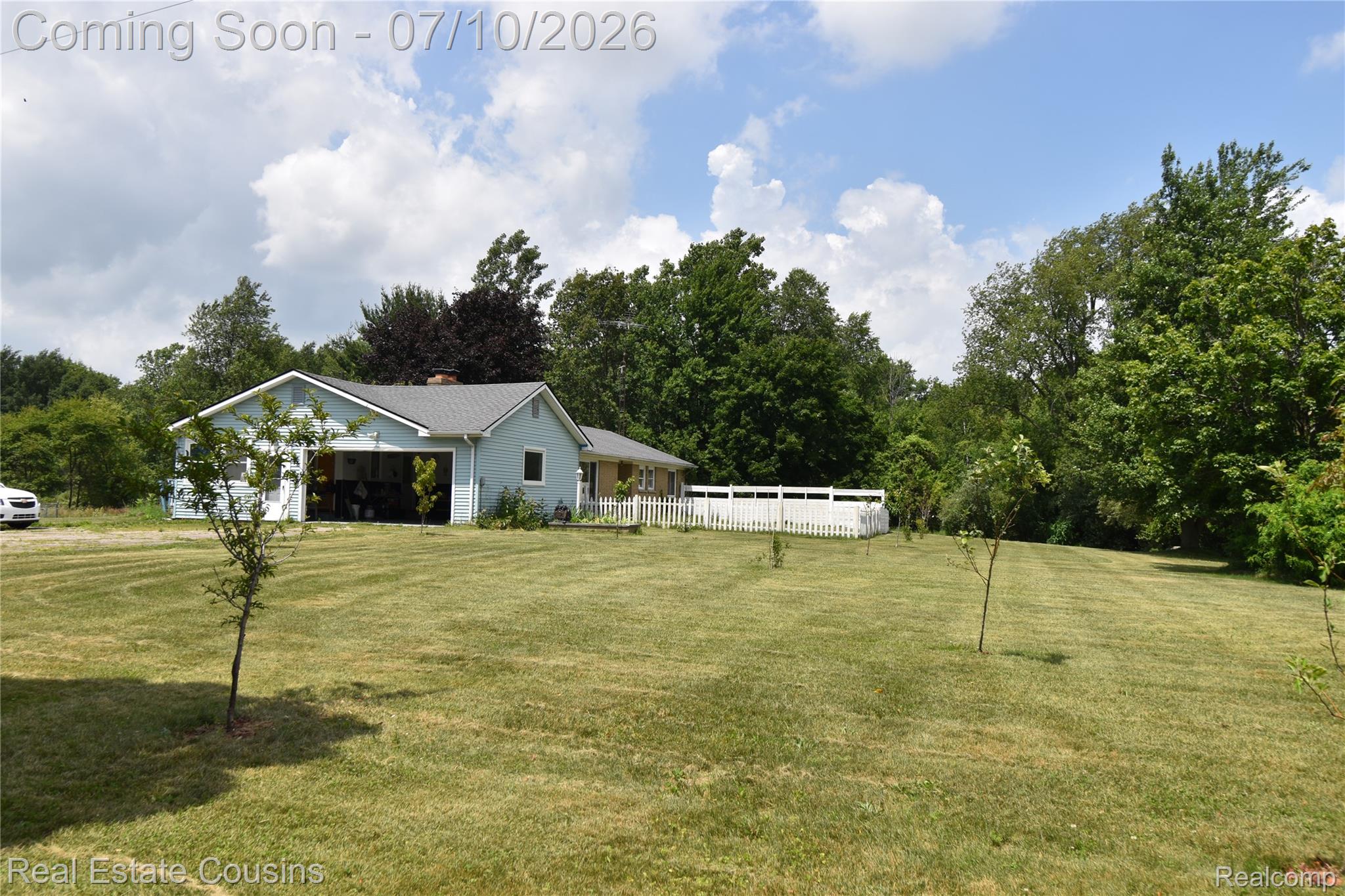 2247 Johnson Mill Road North Branch, MI 48461 - Photo 1 of 22 Expansive lawn with scattered young fruit trees