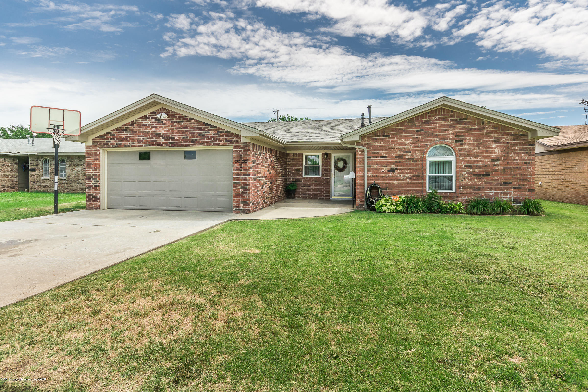 5145 McCarty Boulevard Amarillo, TX 79110 - Photo 1 of 21 a view of a house with a big yard and large tree