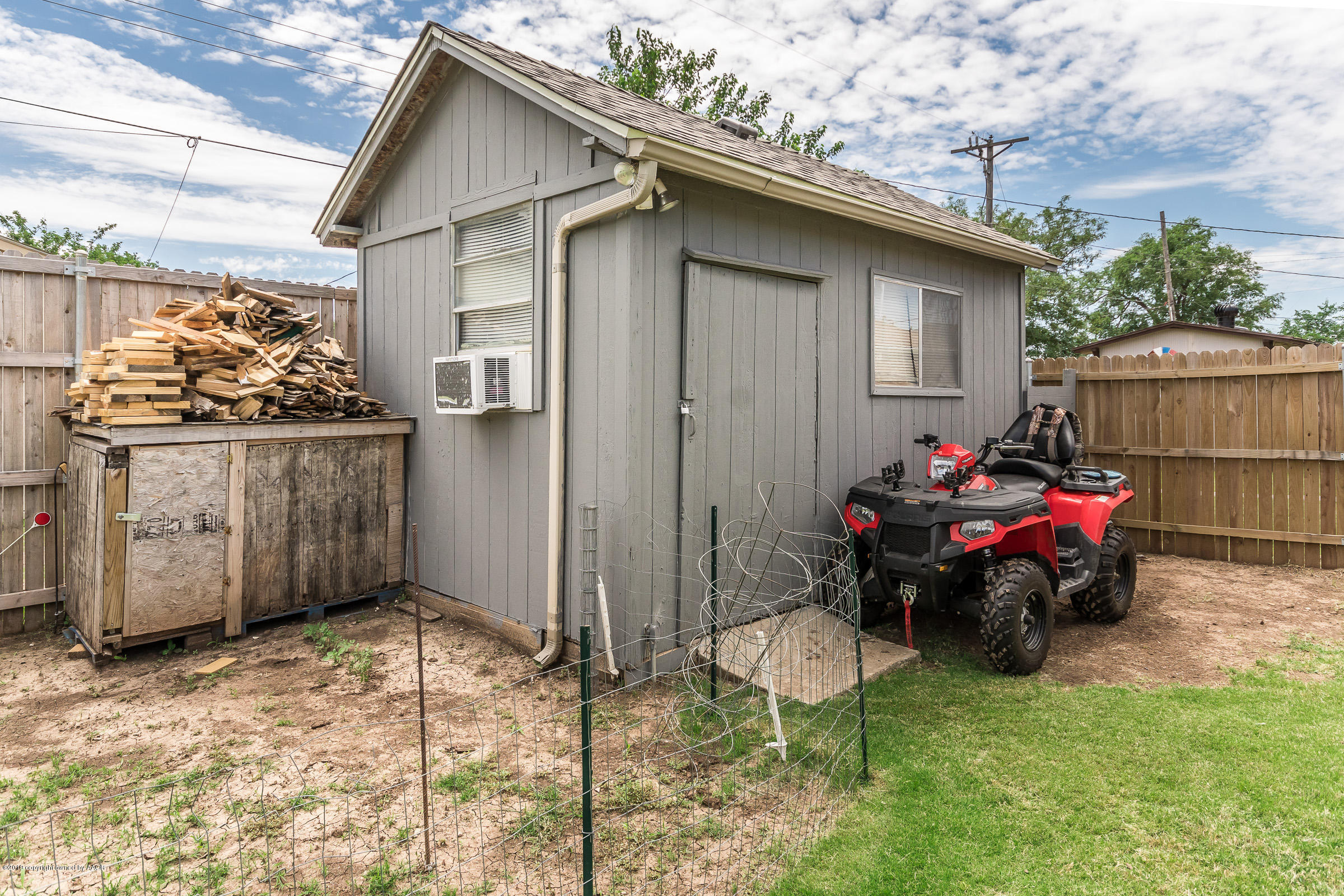 5145 McCarty Boulevard Amarillo, TX 79110 - Photo 18 of 21 a backyard of a house with table and chairs