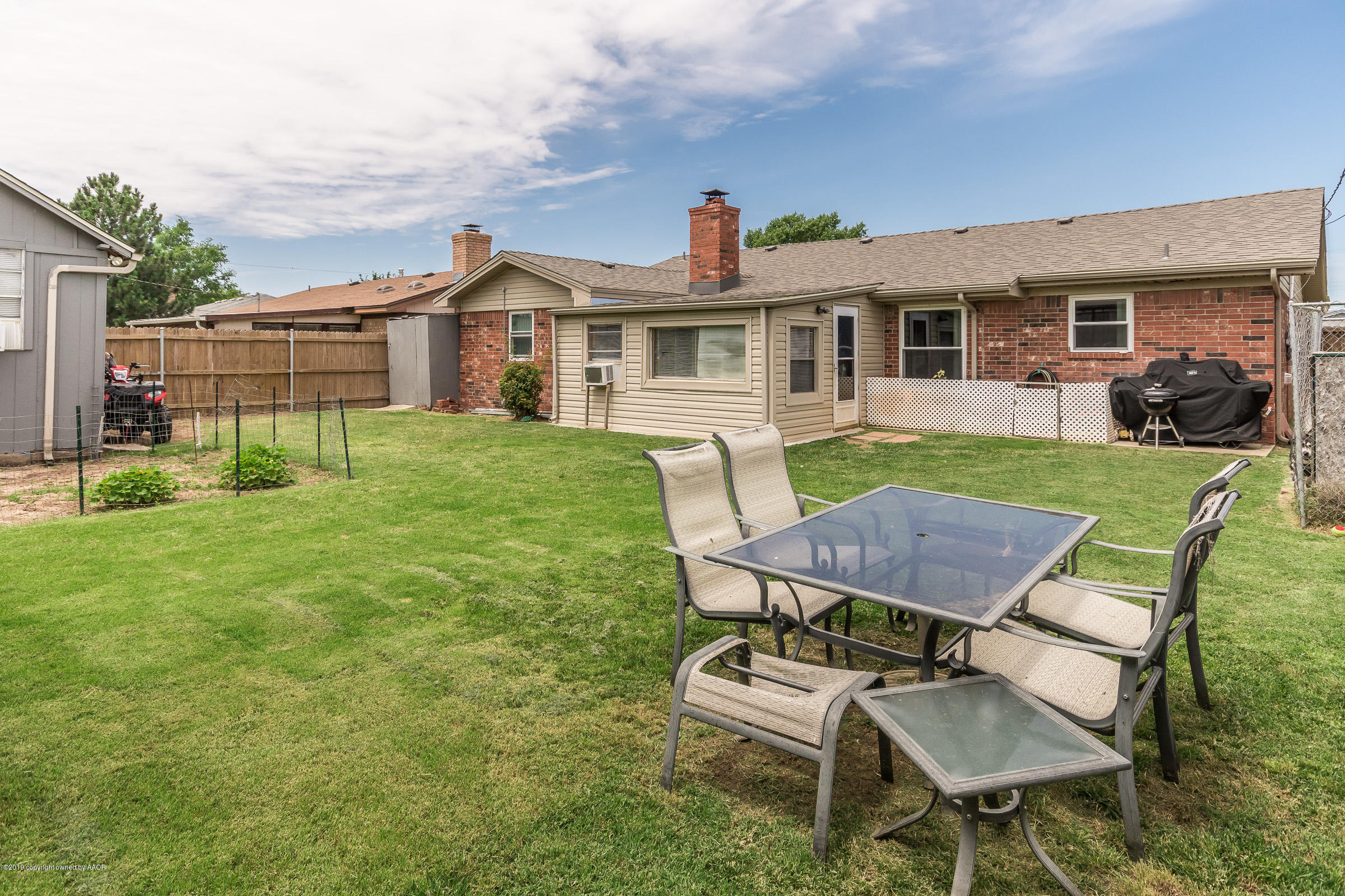 5145 McCarty Boulevard Amarillo, TX 79110 - Photo 20 of 21 a view of a yard with furniture and a table