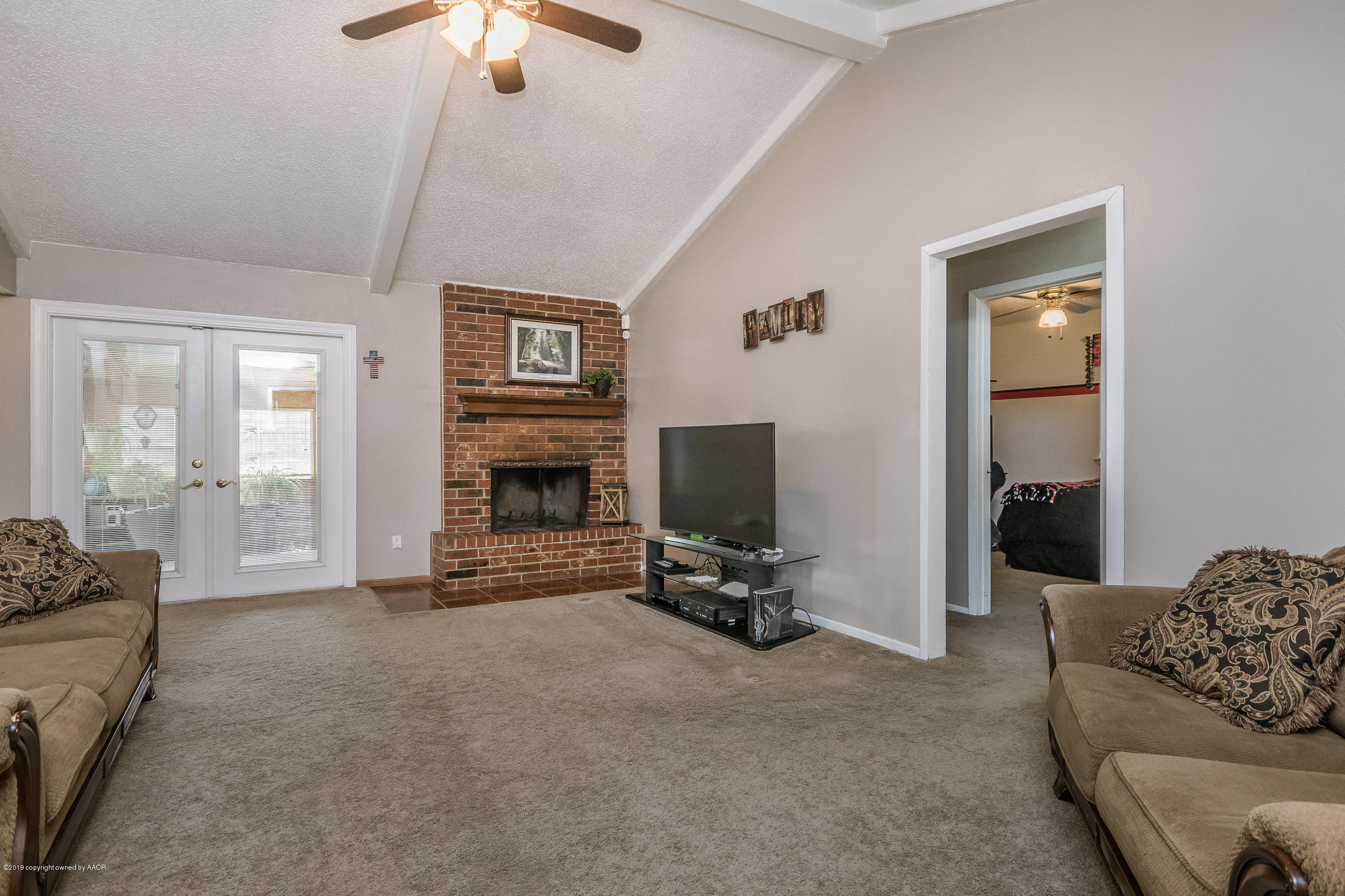 5145 McCarty Boulevard Amarillo, TX 79110 - Photo 4 of 21 a living room with furniture and a flat screen tv