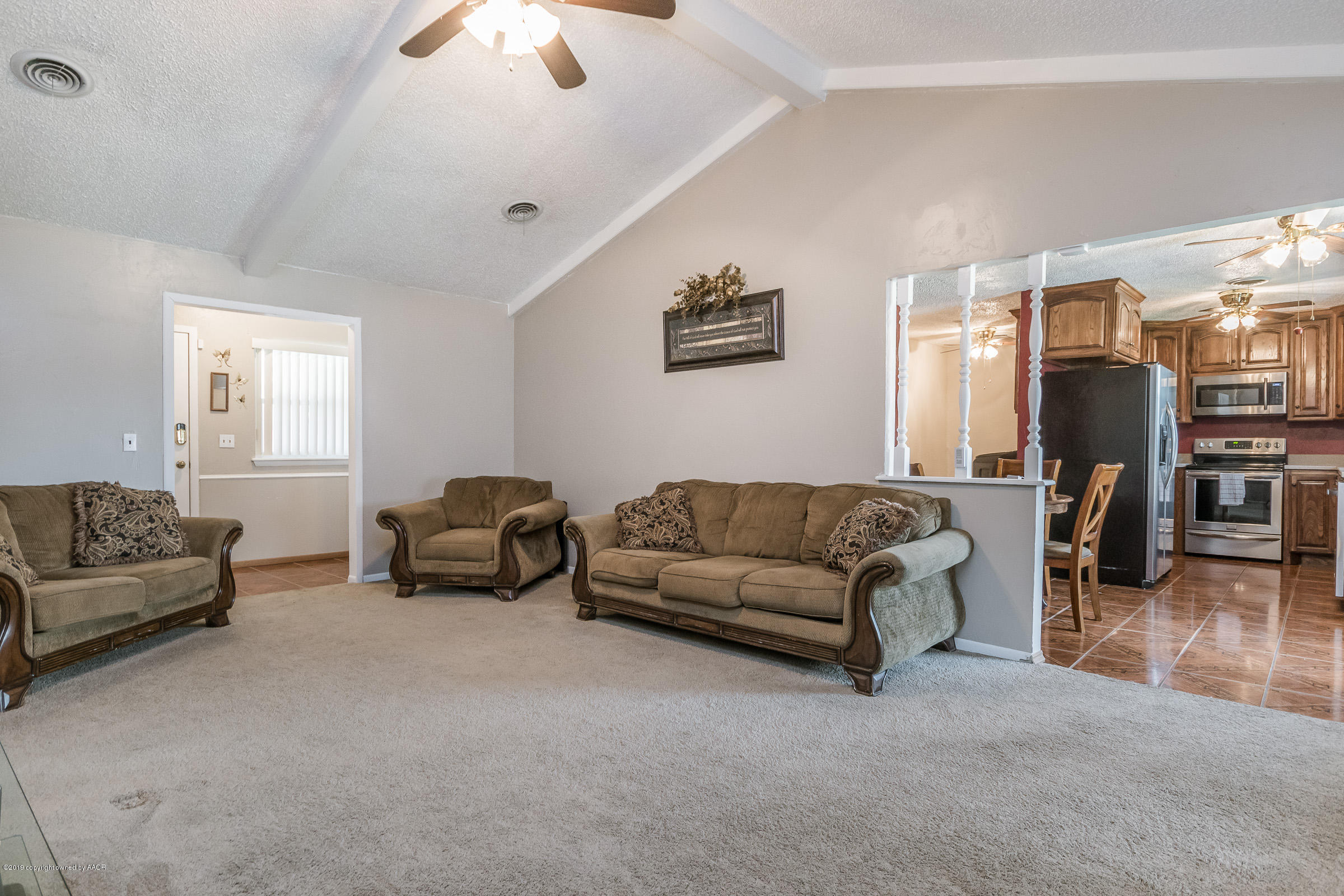 5145 McCarty Boulevard Amarillo, TX 79110 - Photo 5 of 21 a living room with furniture and a flat screen tv