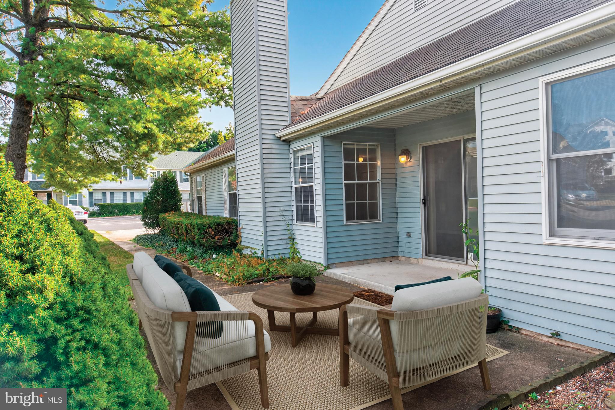 7043 Basswood Road Frederick, MD 21703 - Photo 21 of 34 a view of a house with backyard sitting area and garden