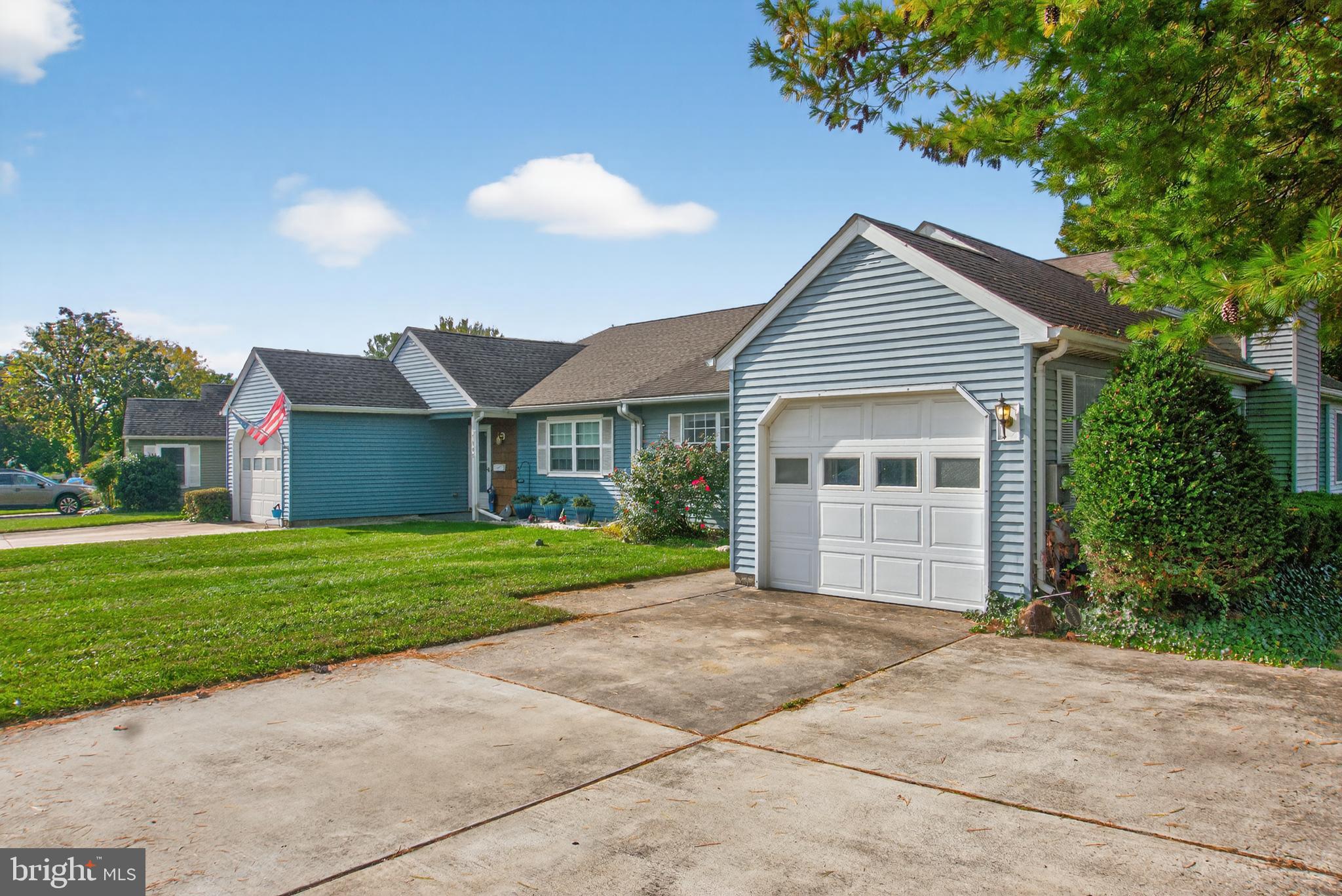 7043 Basswood Road Frederick, MD 21703 - Photo 3 of 34 a front view of a house with a garden and yard
