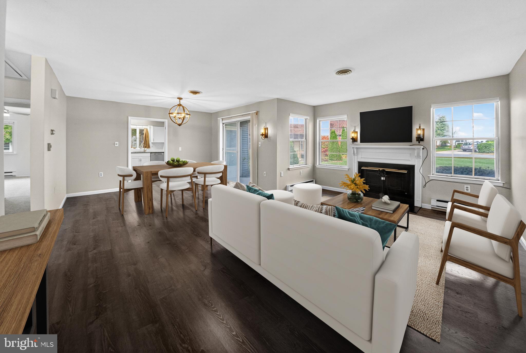7043 Basswood Road Frederick, MD 21703 - Photo 7 of 34 a living room with furniture a flat screen tv and a fireplace