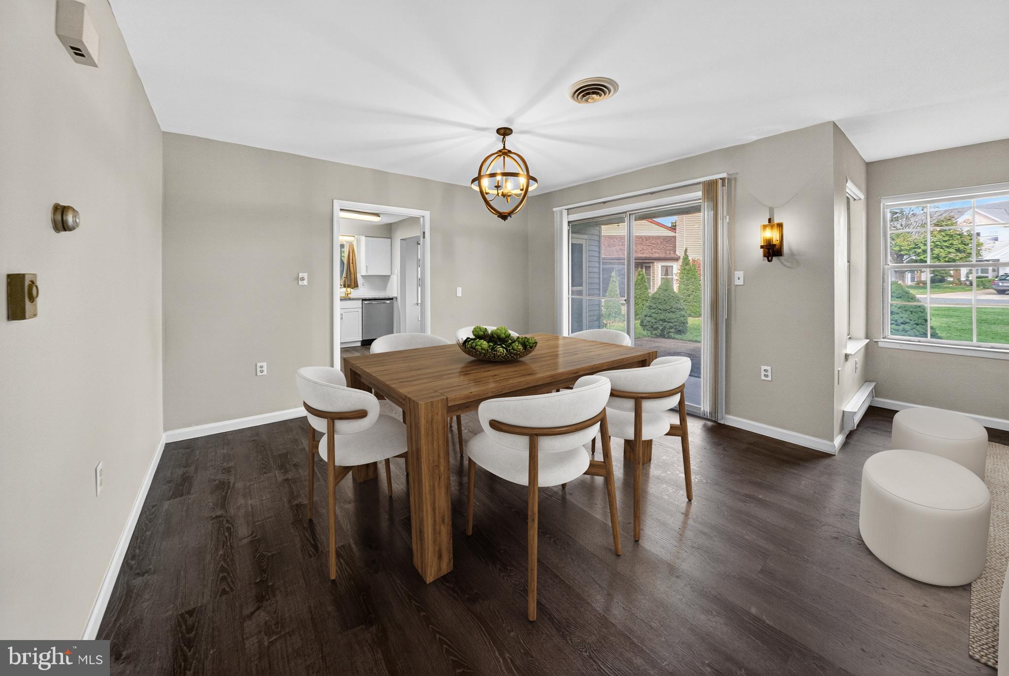 7043 Basswood Road Frederick, MD 21703 - Photo 9 of 34 a view of a dining room with furniture window and wooden floor