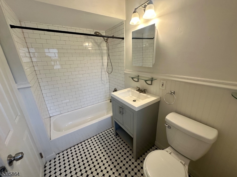 390 Orange Road, Unit 2 Montclair, NJ 07042 - Photo 13 of 16 a bathroom with a toilet sink and shower