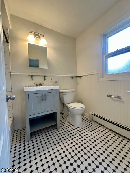 390 Orange Road, Unit 2 Montclair, NJ 07042 - Photo 14 of 16 a bathroom with a toilet a sink and a mirror