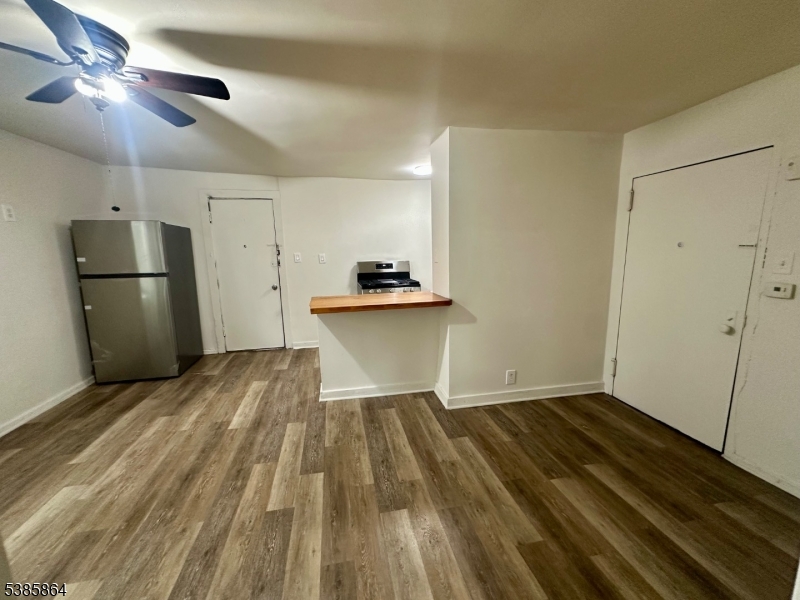390 Orange Road, Unit 2 Montclair, NJ 07042 - Photo 2 of 16 a view of a kitchen with a sink and refrigerator
