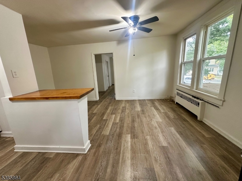 390 Orange Road, Unit 2 Montclair, NJ 07042 - Photo 3 of 16 wooden floor in an empty room with a window
