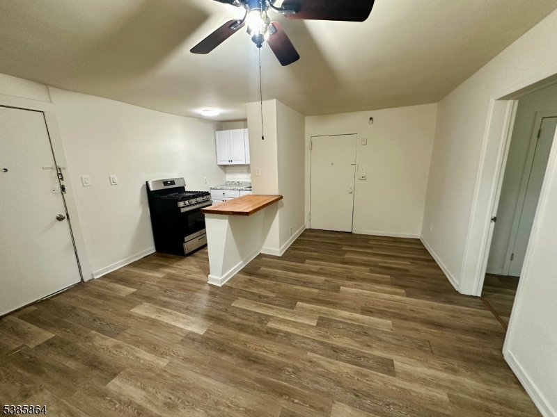 390 Orange Road, Unit 2 Montclair, NJ 07042 - Photo 5 of 16 a view of empty room with wooden floor