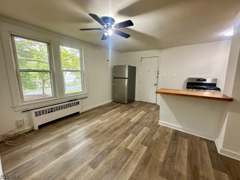 390 Orange Road, Unit 2 Montclair, NJ 07042 - Photo 7 of 16 a view of a kitchen with a sink dishwasher and a window