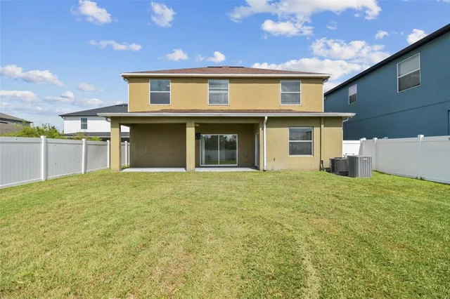 a front view of a house with a big yard